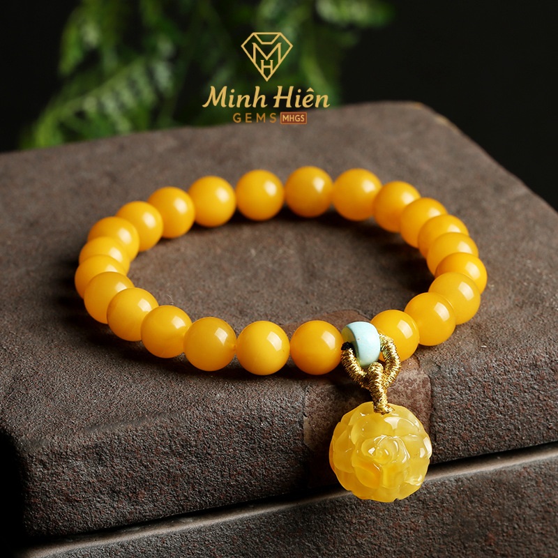 Vòng tay Hổ Phách Sáp Ong vàng mỡ gà treo hoa hồng